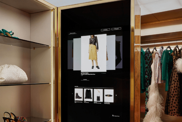 A large touch screen showcasing merchandise inside a luxury boutique