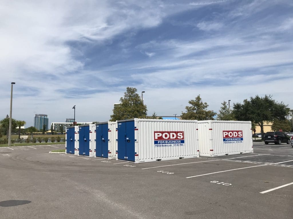 Multiple PODS all-steel commercial containers sitting in a parking lot