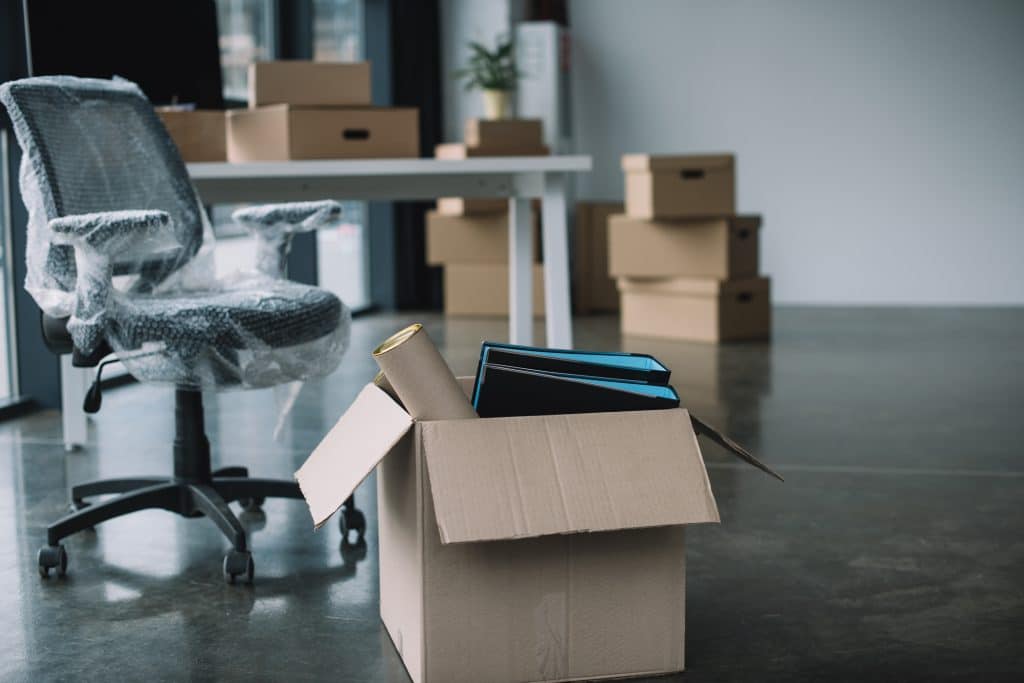 Boxes and unpacked furniture in an office