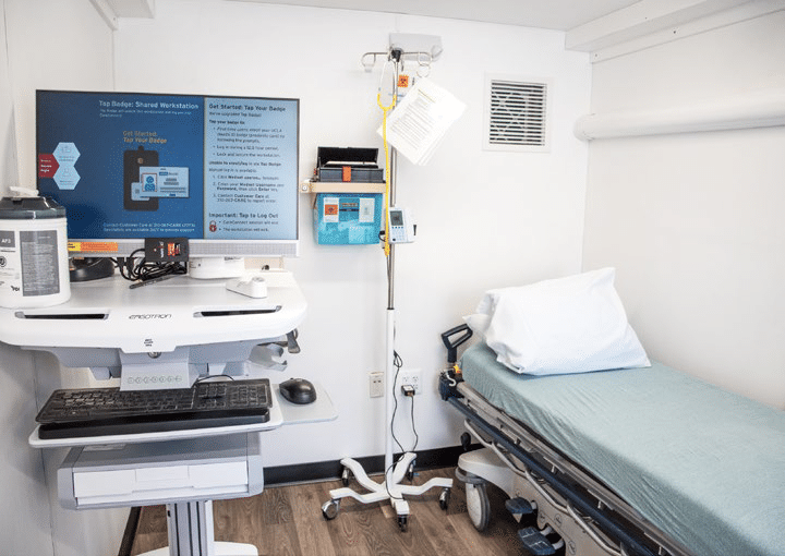 A clinic room with a bed inside a storage container