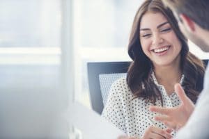 Employee reviewing paperwork with employer for a corporate relocation