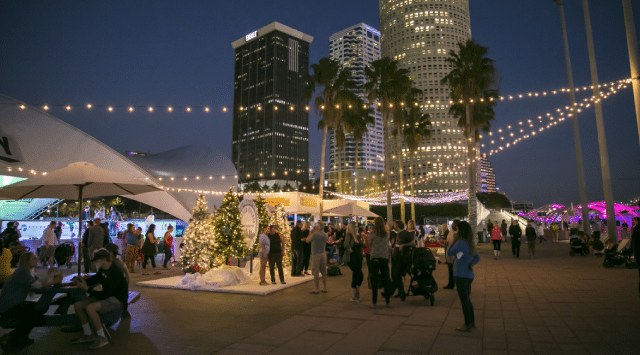 Festive holiday decor at an outdoor dining area at the annual Winter Village in Tampa