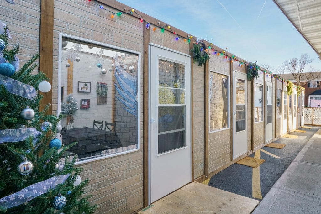 PODS containers being used as single-party dining rooms at a restaurant