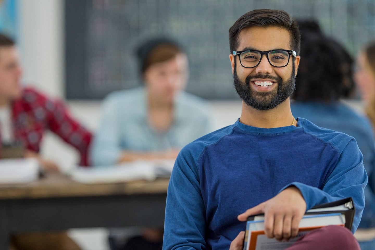 A smiling male student who appears to have a healthy wellbeing