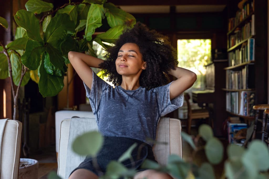 Young woman leaning back in chair  in Los Angeles office