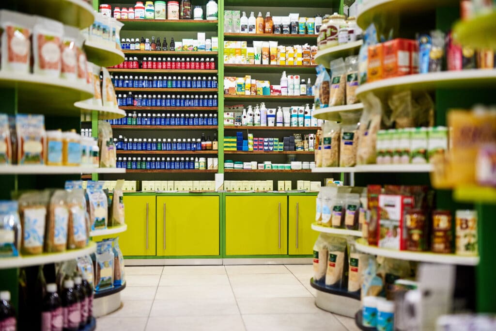 Photo of the inside of the health section of a small retail grocery store
