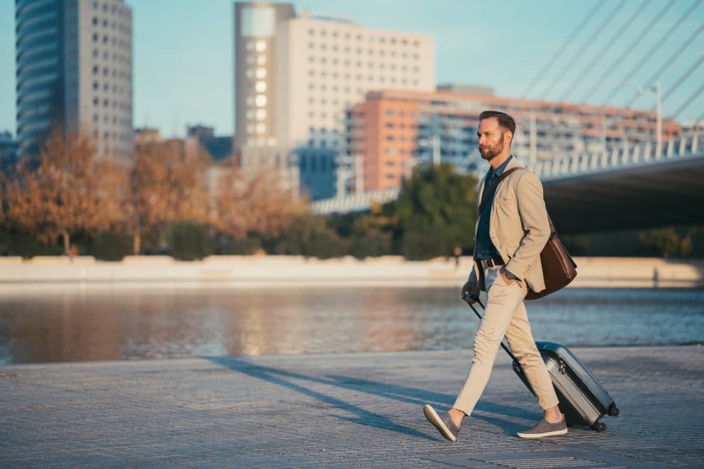 Business man walking bya