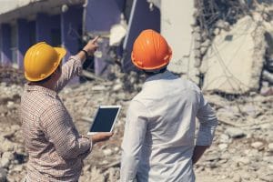 Construction workers using a tablet on a jobsite