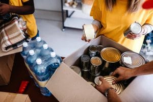 Volunteers packing boxes with supplies for disaster relief