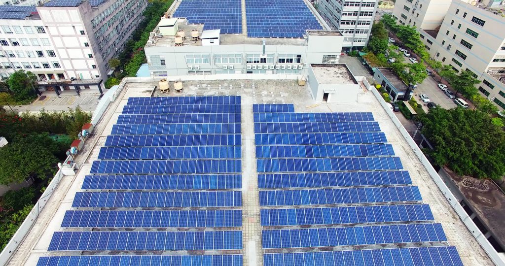 Solar panels cover the roof of a sustainable hotel