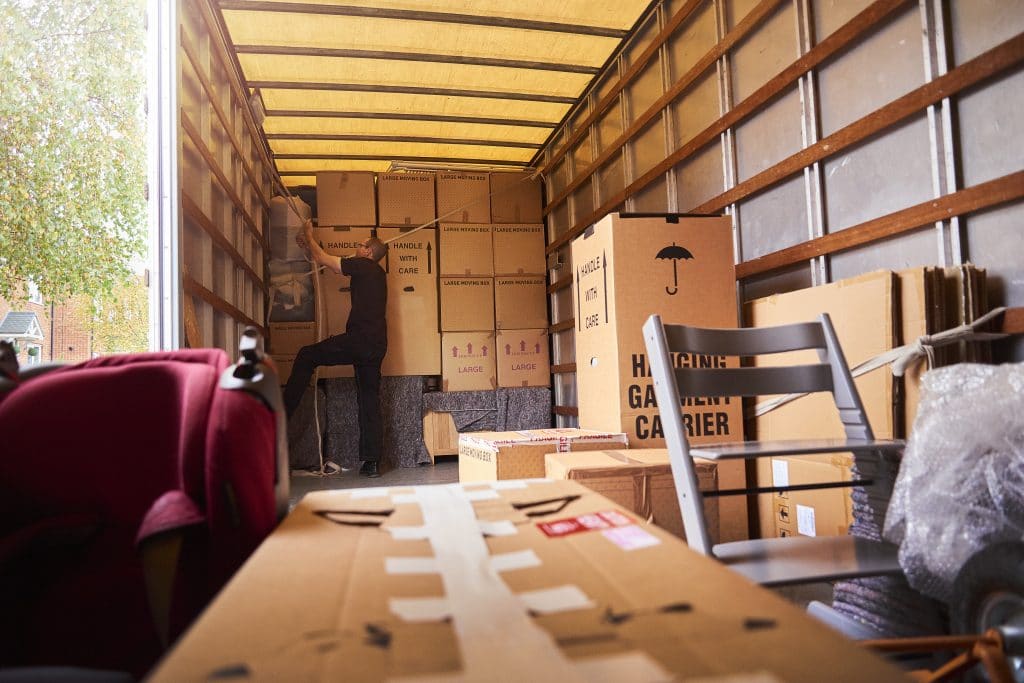 Boxes and furniture inside a moving truck rental