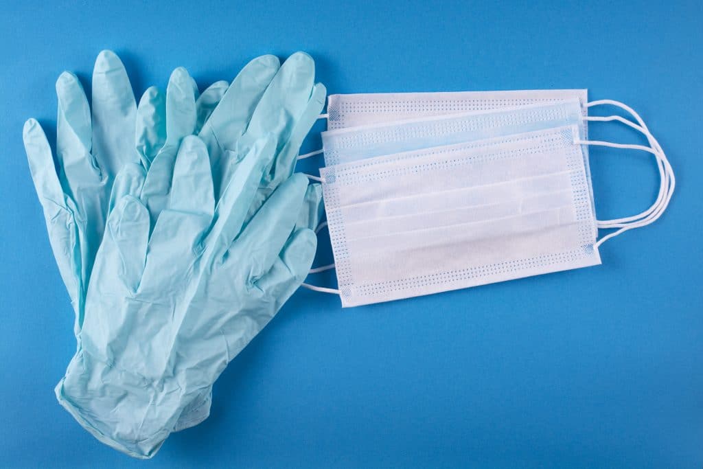 Medical gloves and face masks on a table