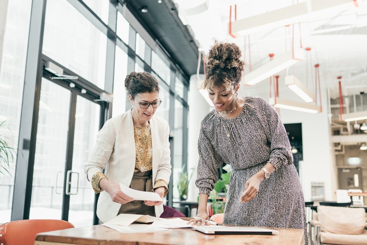 Two retail professions making plans to redesign a retail store layout