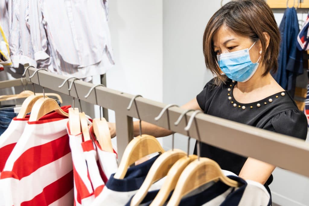 Women wearing facemask while shopping inside a store
