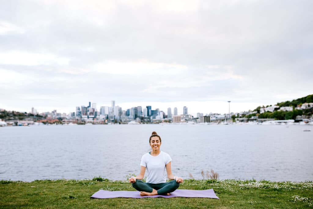 An adult woman takes time for self care in an urban park setting of Seattle, Washington