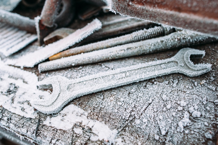 Tools covered in snow on a winter construction site
