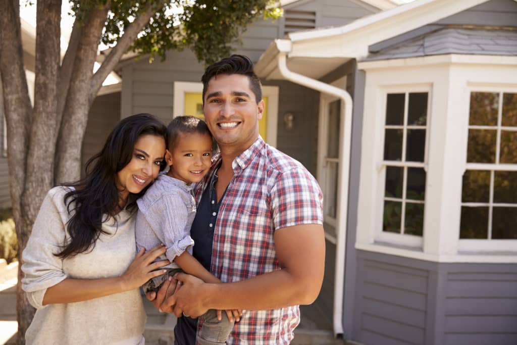 Portrait ff family standing outside home in Los Angeles