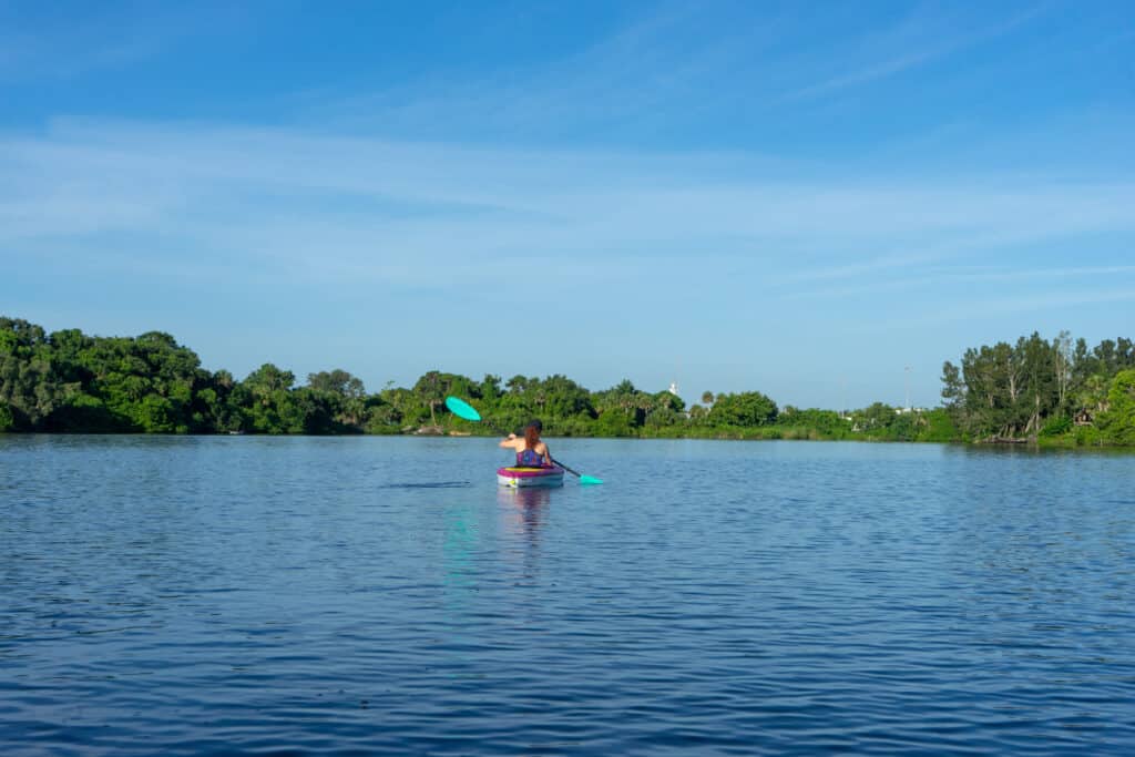 Young woman kayaking on Crane's Creek in Melbourne Florida