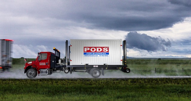 A PODS container being delivered in the aftermath of a hurricane