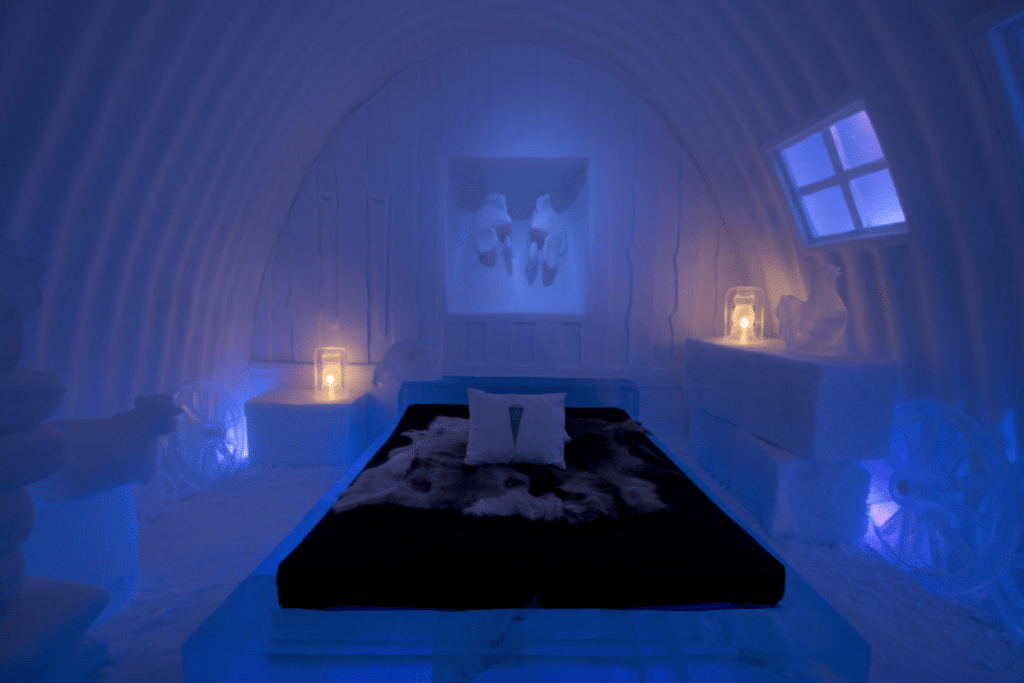 A bedroom at night inside the Ice Hotel in Sweden