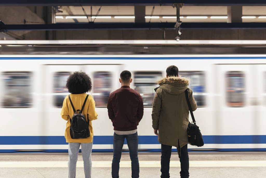 Millenials wait for subway 