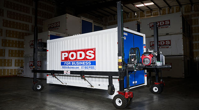 PODS commercial container sitting on a hydraulic lifting system