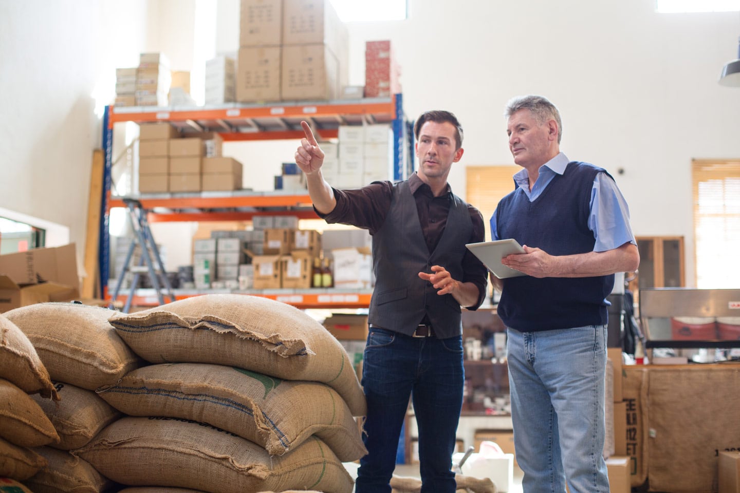 Two logistics employees working in a warehouse