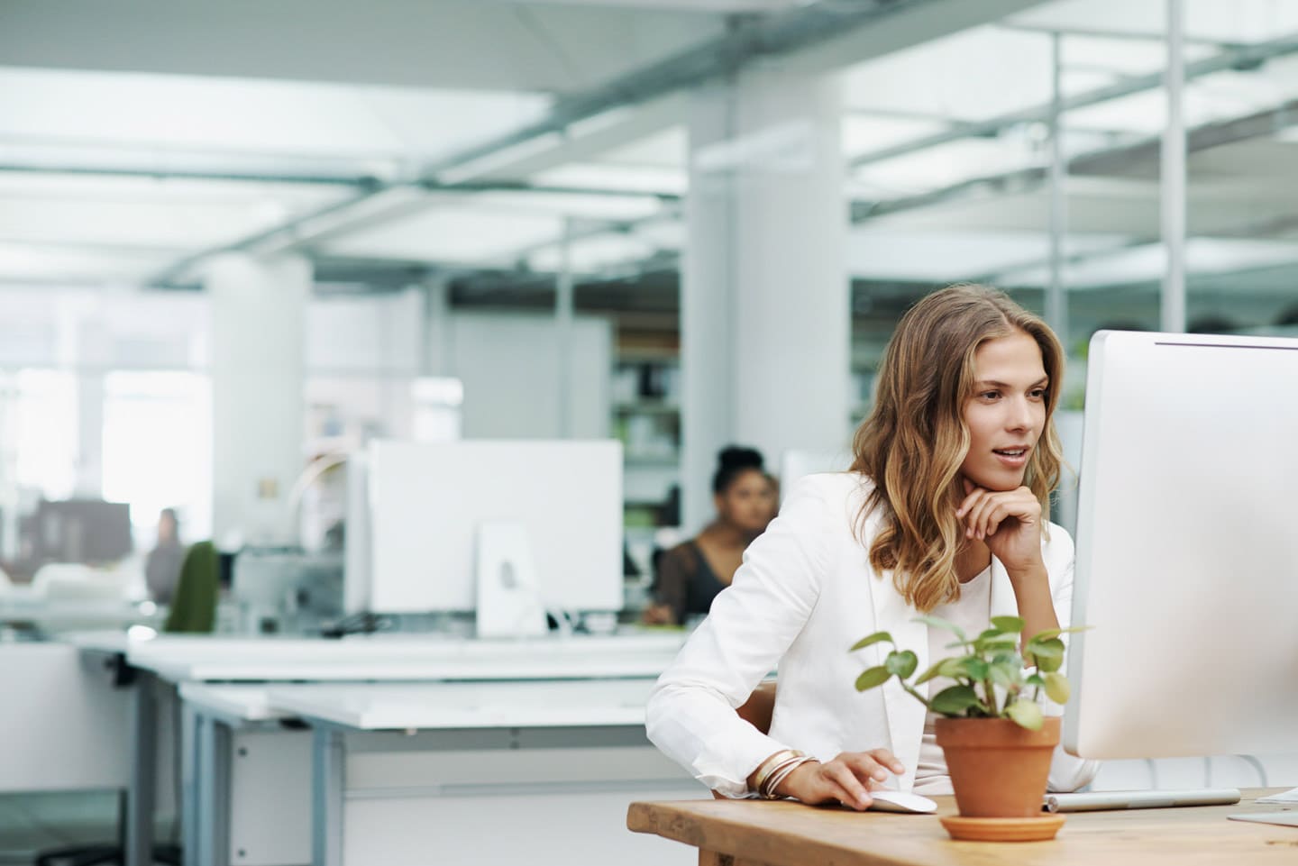 Millennial employee on office computer