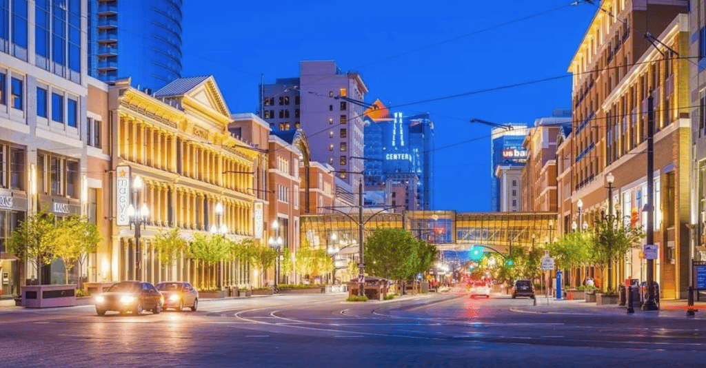 Buildings and street illuminated at night in downtown Salt Lake City