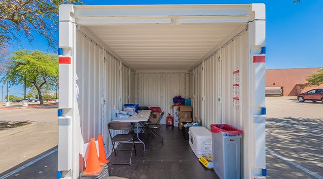 An open PODS container in a parking lot filled with medical supplies