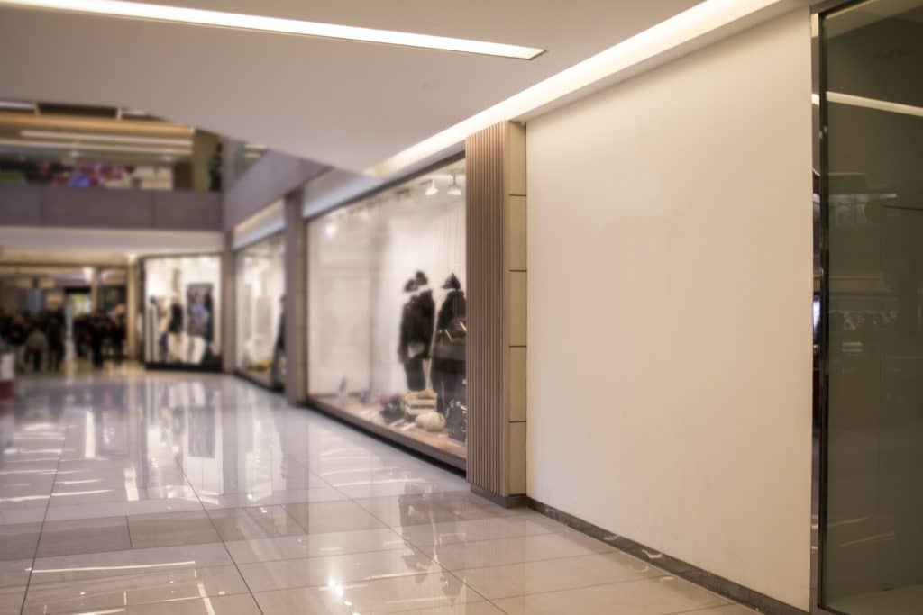 A storefront inside an empty shopping mall