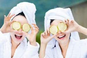Two women enjoying a natural spa treatment to improve wellness