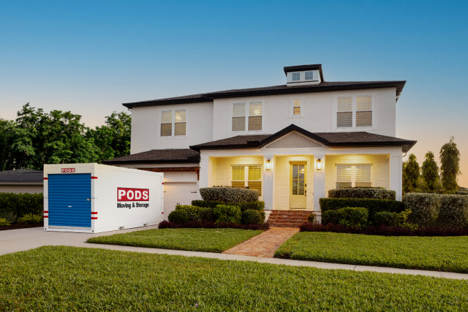 A PODS container is conveniently positioned in the residential driveway in one of the best cities near Long Beach, California, ready to be unloaded into the home.