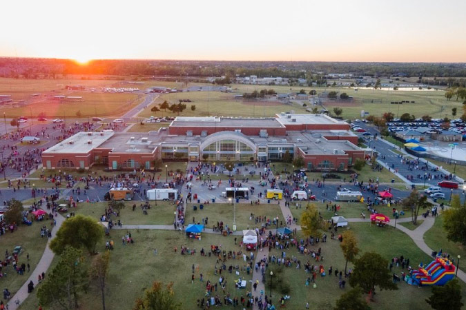 Aerial sunset view of Pack the Park, a community event in Mustang, Oklahoma