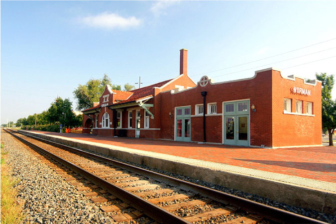 A railroad and old brick building in Norman, Oklahoma