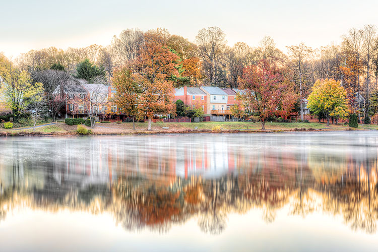 Ashburn townhomes seen from a river in the fall