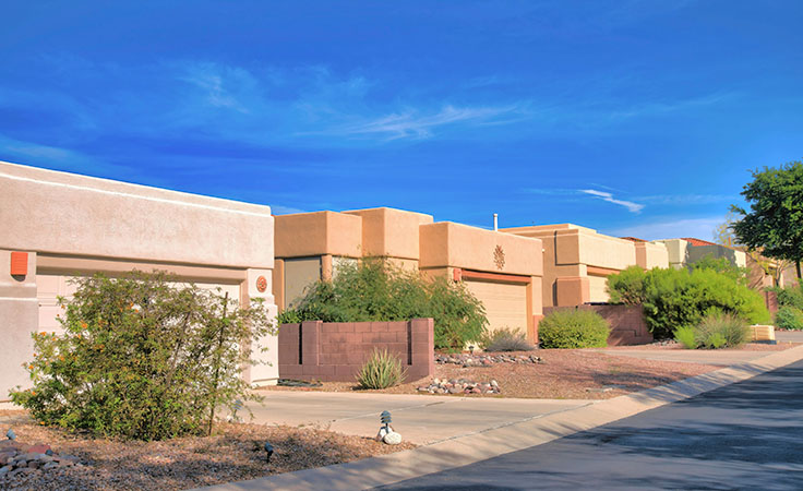 Attached garages of suburban Tucson homes. The homes’ design is distinctly Southwestern.