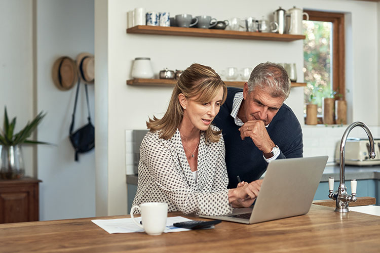 A couple approaching retirement calculating their living costs after they stop working