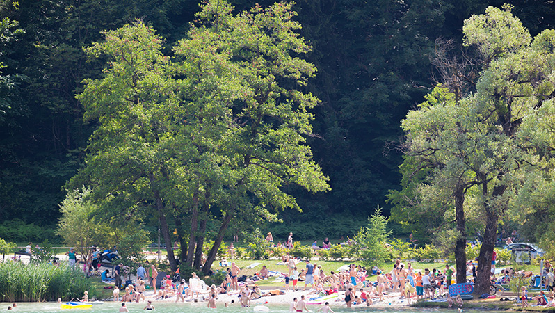 A crowded lakefront beach