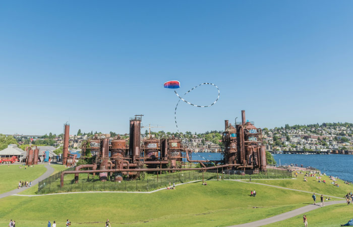 Locals enjoy a sunny day at Gasworks Park in Seattle, Washington.