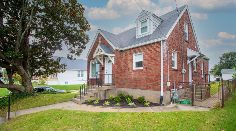 A small, red brick home in the Germantown neighborhood of Louisville, Kentucky.