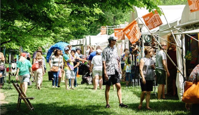 Locals explore an outdoor event at the Indianapolis Art Center.