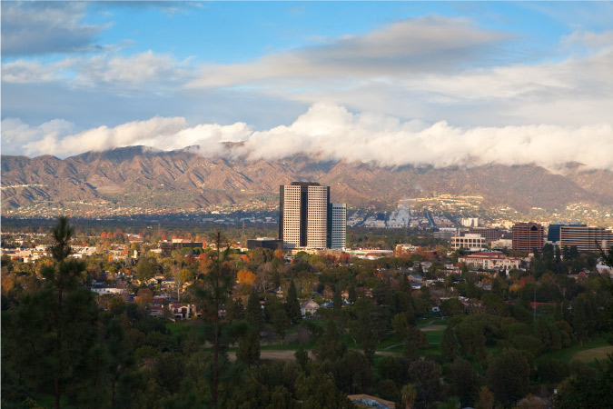 Distant view of Burbank and Universal City with the foggy mountains in the background.