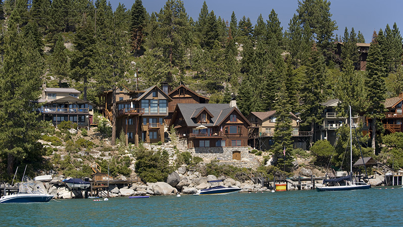 A large, multi-story home on the shores of Lake Tahoe