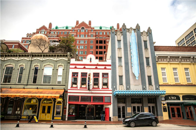 Street-level view of a few art deco building facades in downtown Fort Worth, Texas