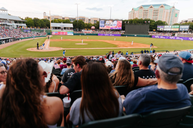 Fans enjoy a minor league baseball game at Riders Field in Frisco, Texas. 