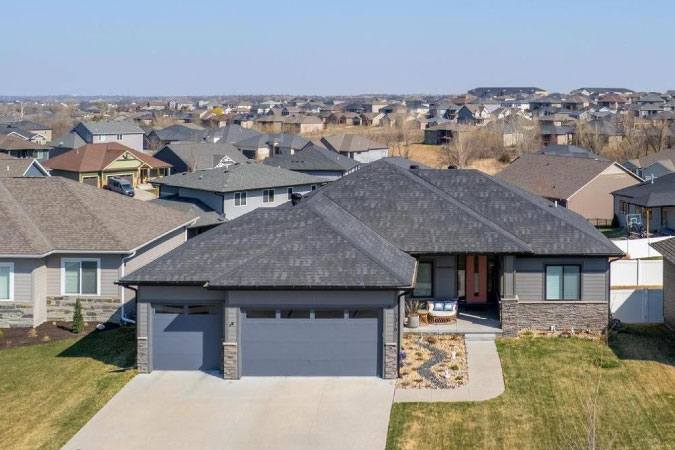 Drone view of a residential neighborhood in Lincoln, Nebraska, on a sunny day.