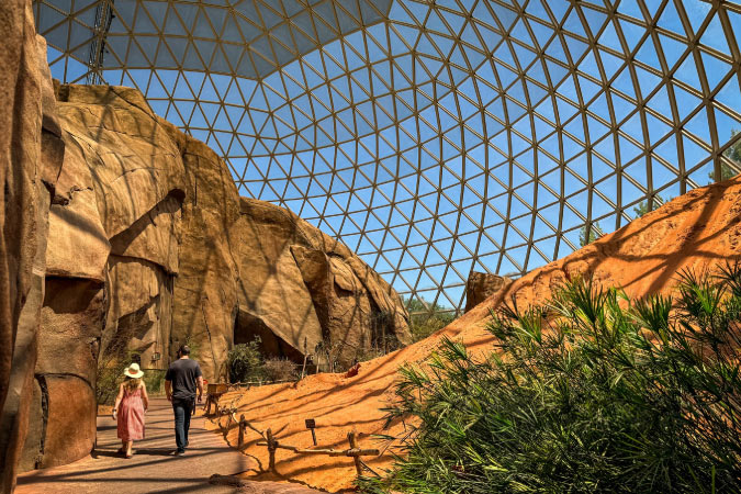A couple walks through the stunning Desert Dome exhibit at Omaha’s Henry Doorly Zoo and Aquarium.
