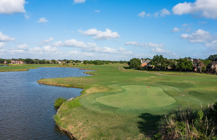 Waterside view of the Southwyck Golf Club in Pearland, Texas, on a beautiful summer day.