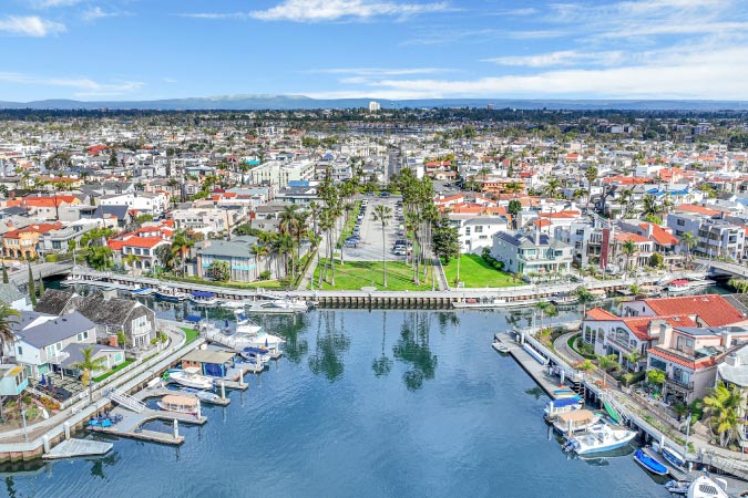 Aerial view of Naples, one of the best Long Beach neighborhoods, featuring luxury waterfront properties and private docks.